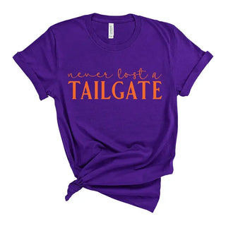 Orange Never Lost a Tailgate T Shirt Football Game Day Fan Tee #HPTS-ORGTAIL - Purple / Small - Screen Printed T-Shirt